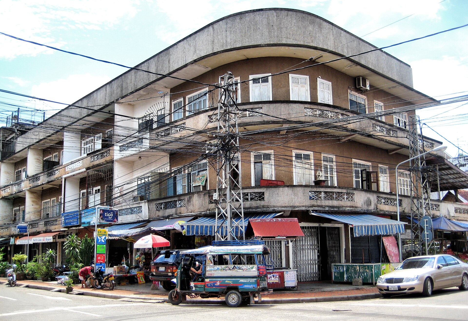 An older multi-story apartment building in Vientiane